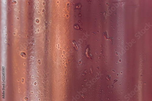 drops of water on a dark plastic bottle beautiful abstraction