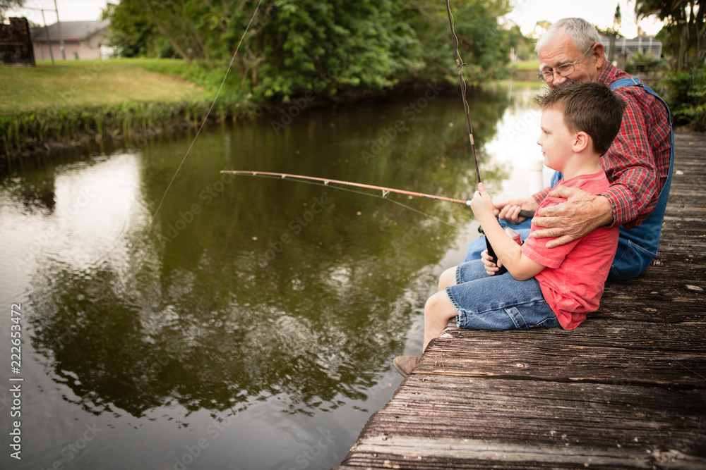 Fototapeta premium Happy Great Grandfather and Grandson Fishing Together