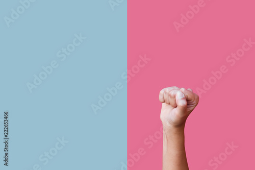 A fist isolated on pink and blue backround
