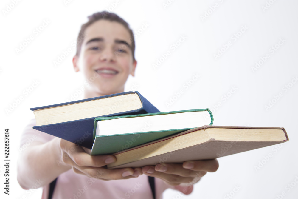 young student with books in the foreground isolated in white
