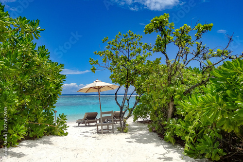 Maldives Beach with Chair and Umbrella in White Sand