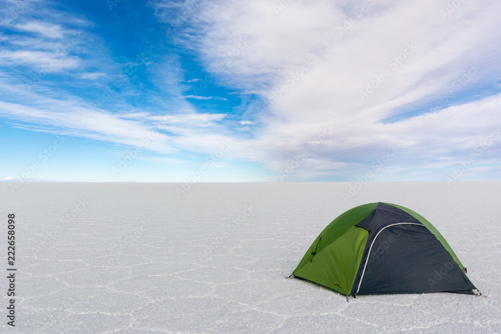 Lonely Tourist Tent in wide white Salt Desert Salar de Uyuni Bolivia