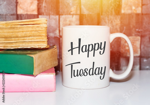 Bilde på lerret Happy tuesday word on white morning coffee cup and books