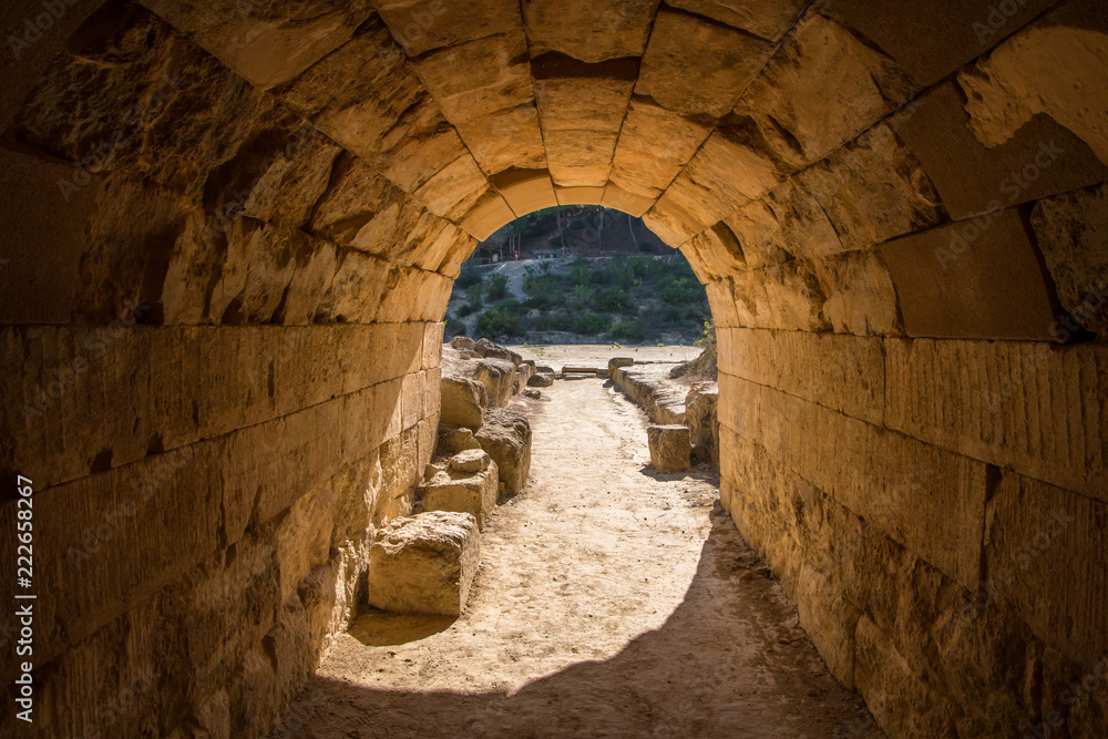 Entrance tunnel from where the athletes enter to the ancient Panhellenic stadium at archaeological site of Nemea in Greece