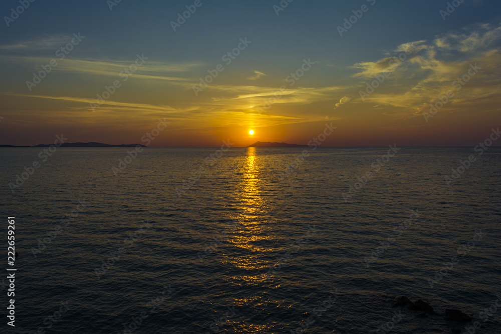 Beautiful sunset at Logas beach at Peroulades village of Corfu island, Greece