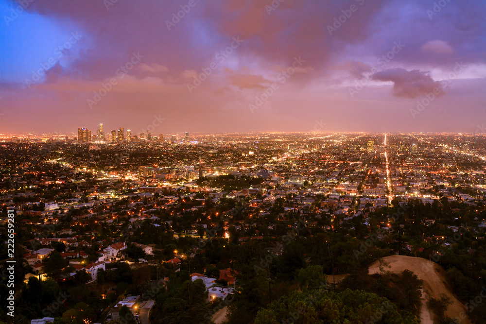 Colorful Sunset over Los Angeles with streets and houses in foreground Colorful Sunset over Los Angeles with streets and houses in foreground