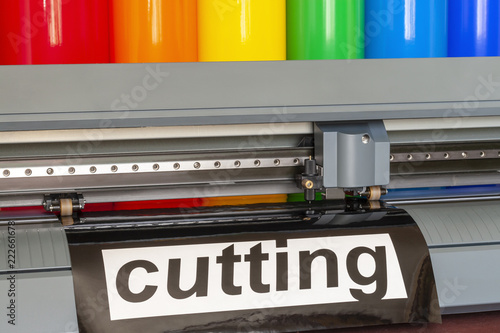 Cutting plotter close-up. The process of cutting a vinyl film. photo