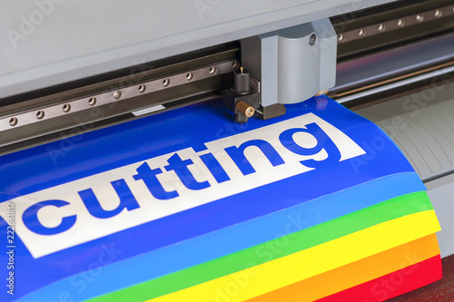 Cutting plotter close-up. The process of cutting a vinyl film.