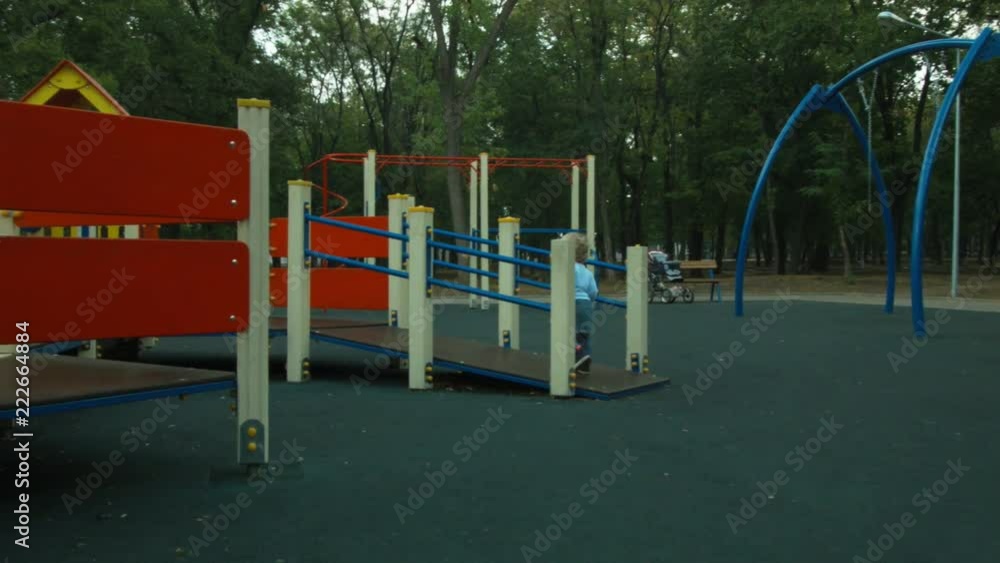 Little girl runs around the playground Little girl runs around the playground