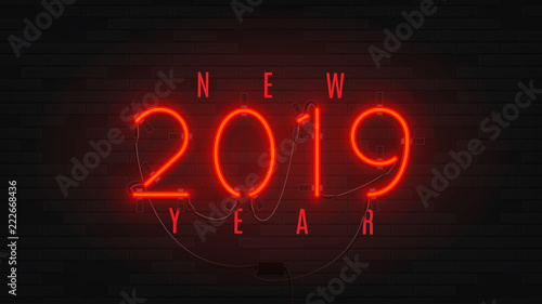 Neon web banner for Happy New Year 2019. Retro neon red bilboard on brick wall. Concept of holiday card with glowing text.