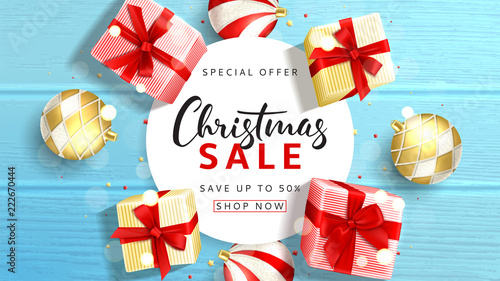 Web banner for Christmas sale. Elegant background with top view on realistic gift boxes and Christmas balls on rustic wooden texture. Vector illustration with confetti and effect bokeh.