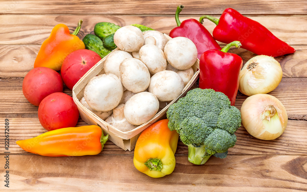 Heap of different vegetables on the wooden table. Heap of different vegetables on the wooden table.