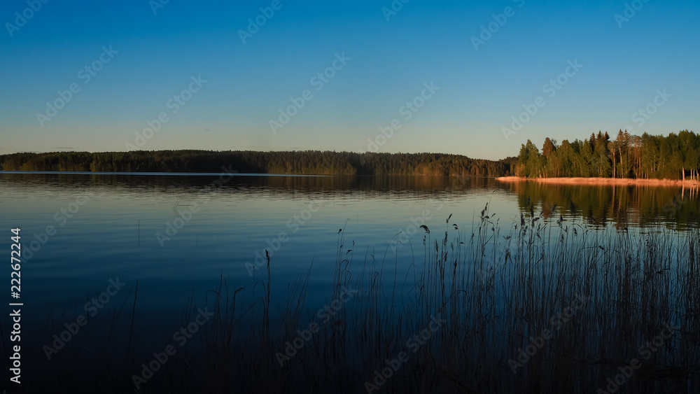 sunset at saimaa lake in finland