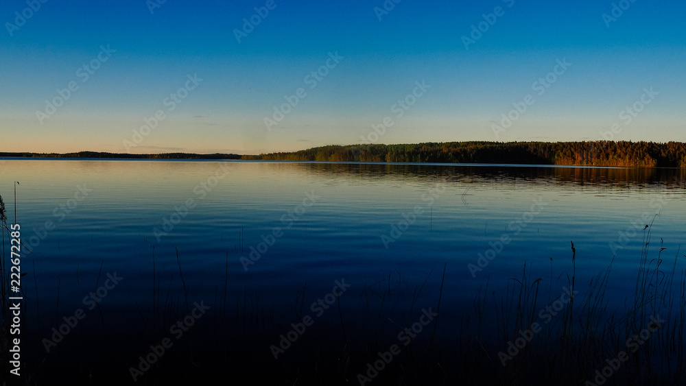 sunset at saimaa lake in finland
