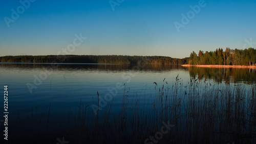 sunset at saimaa lake in finland