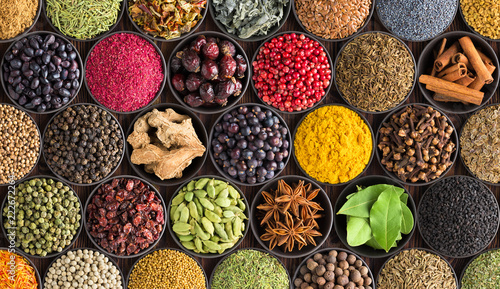 Fototapeta Naklejka Na Ścianę i Meble -  colorful spice background, top view. Seasonings and herbs for Indian food