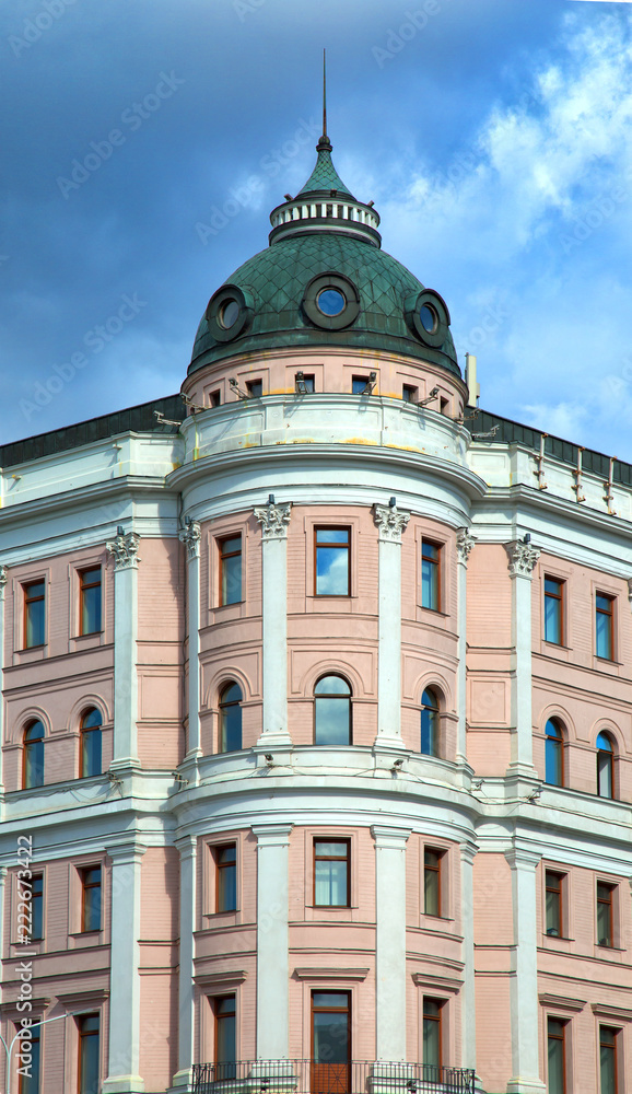 Facade of a historic pink building on tverskaia street in Tverskoi area in Moscow, Russia.