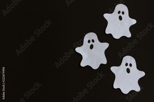 Elements of halloween decoration, ghots on black background. Holidays, decoration and party concept. Top View. Copy Space
