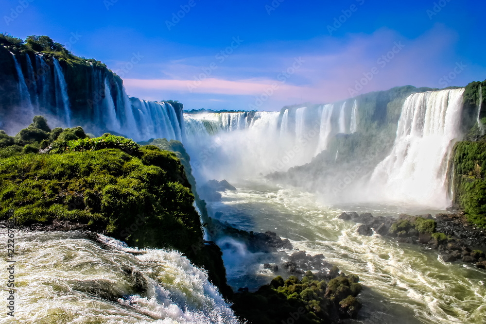 Water cascading over the Iguacu falls in Brazil - obrazy, fototapety, plakaty 
