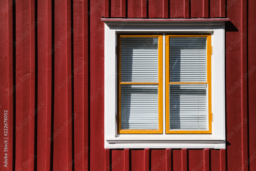 Window with blinds on red house Window with blinds on red house