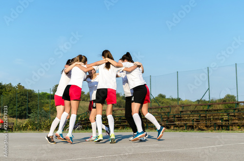 Handball team huging