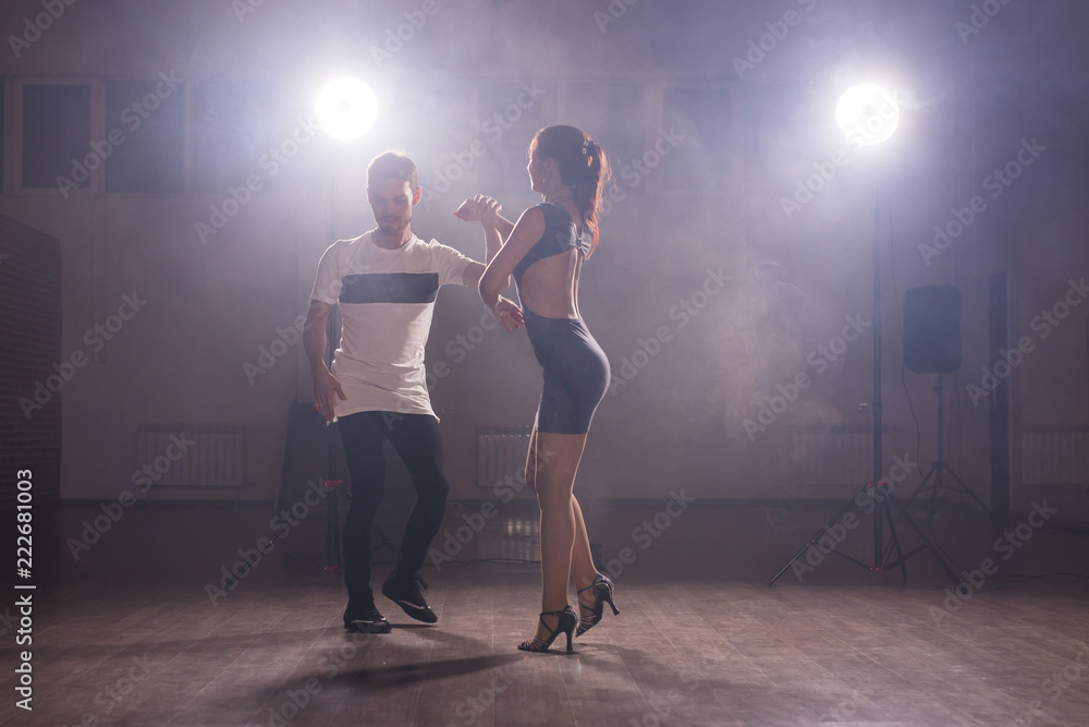 Active happy adults dancing bachata together in dance class Active happy adults dancing bachata together in dance class