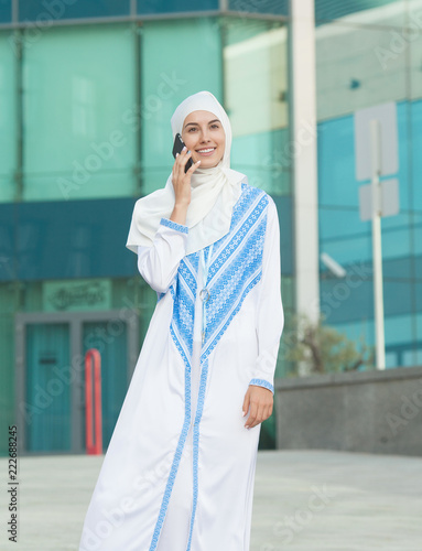 Muslim woman talking on the phone