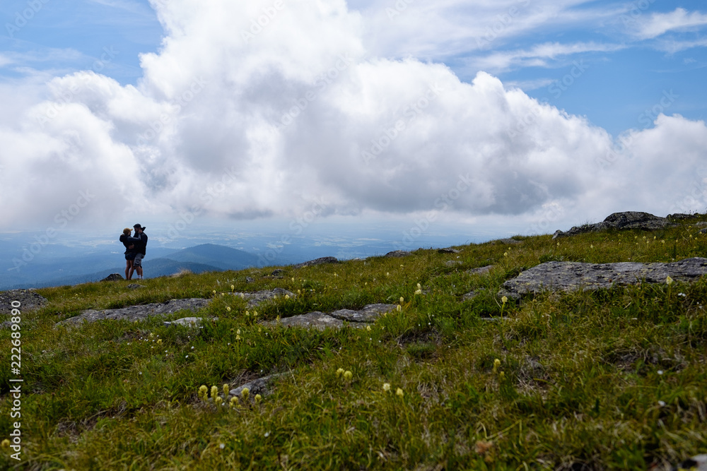 Young couple embracing on a mountaintop