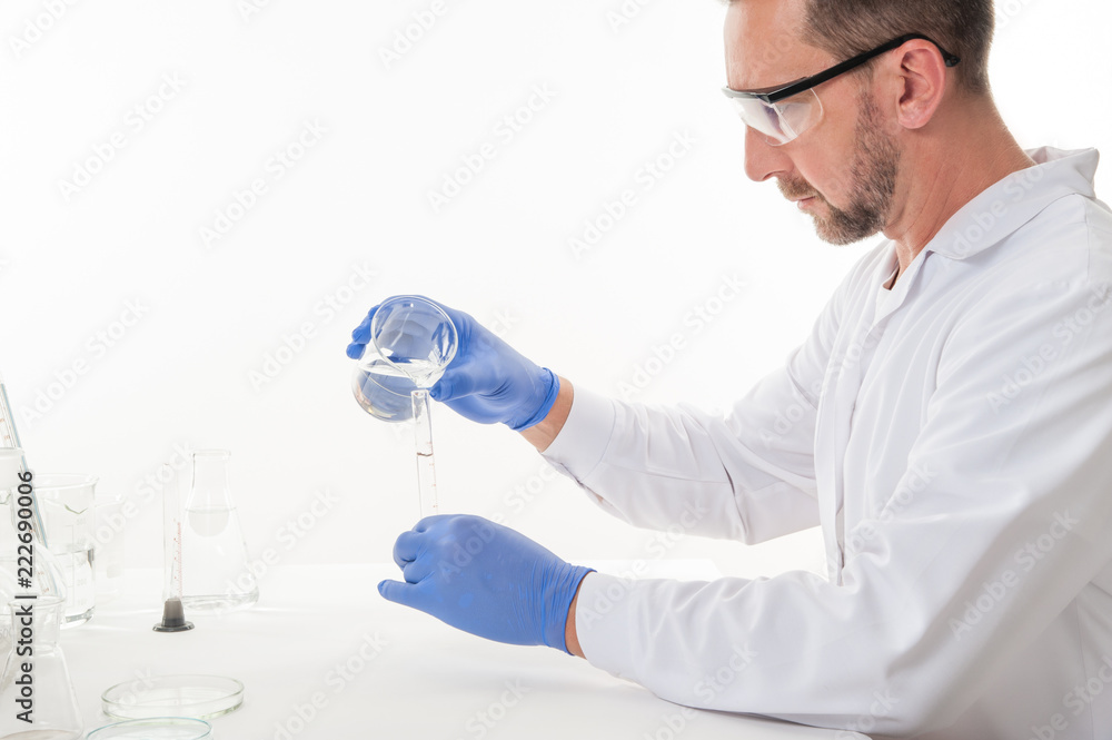 man in the laboratory / view of a man in the laboratory while performing experiments
man in the laboratory / view of a man in the laboratory while performing experiments