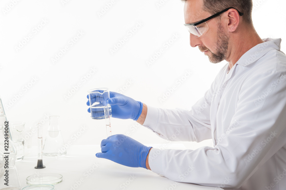 man in the laboratory / view of a man in the laboratory while performing experiments
man in the laboratory / view of a man in the laboratory while performing experiments