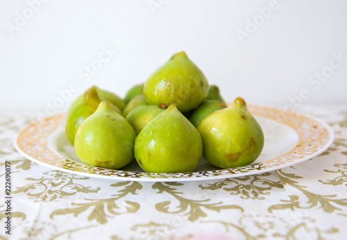 green figs on a plate photo