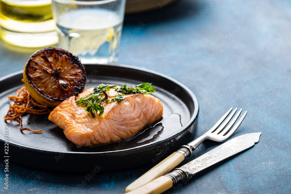 Salmon Sole Meuniere with lemon. Fillet of red fish. Steak trout fried with butter, lemon and parsley sauce Salmon Sole Meuniere with lemon. Fillet of red fish. Steak trout fried with butter, lemon and parsley sauce
