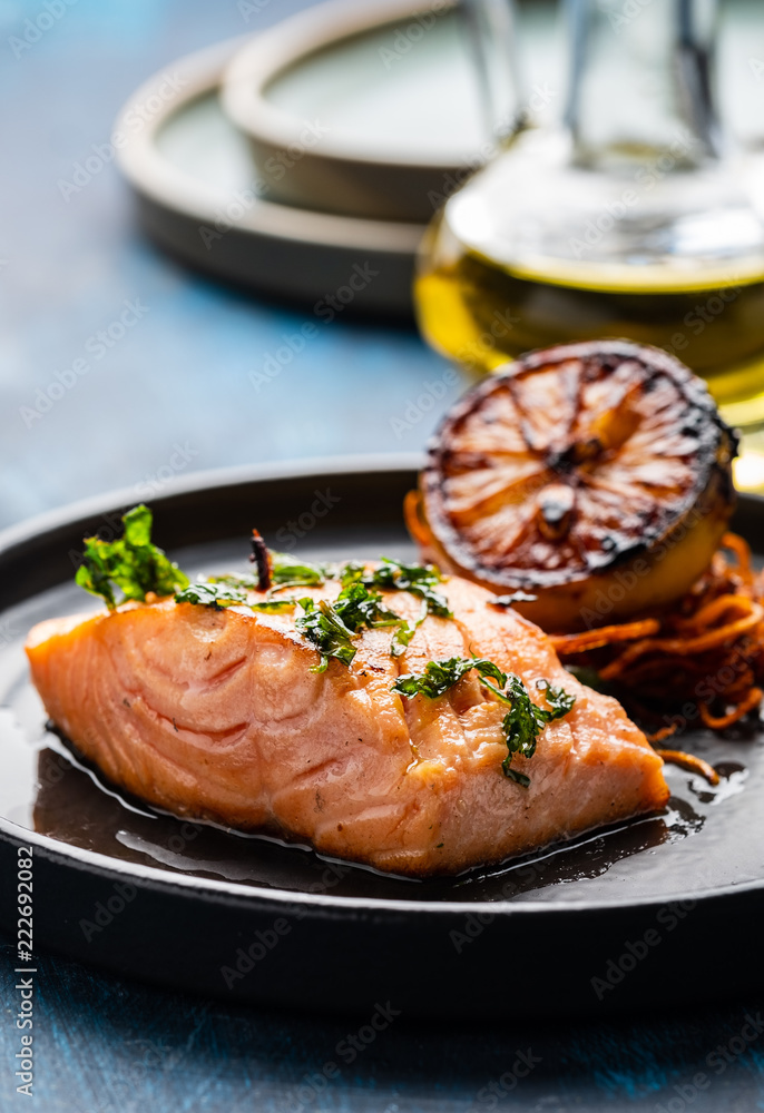 Salmon Sole Meuniere with lemon. Fillet of red fish. Steak trout fried with butter, lemon and parsley sauce Salmon Sole Meuniere with lemon. Fillet of red fish. Steak trout fried with butter, lemon and parsley sauce