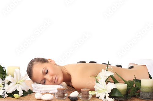 woman lying down relaxing on a massage bed at spa