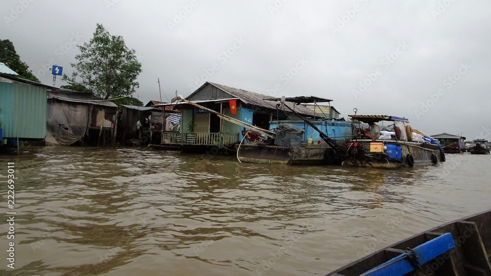 Small houses on the side of the mekong delta Small houses on the side of the mekong delta