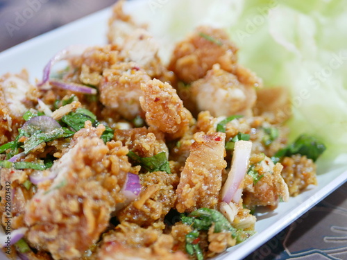Selective focus of Spicy Chicken Salad ( Yam Kai Saep ) - delicious and healthy street food in Thailand