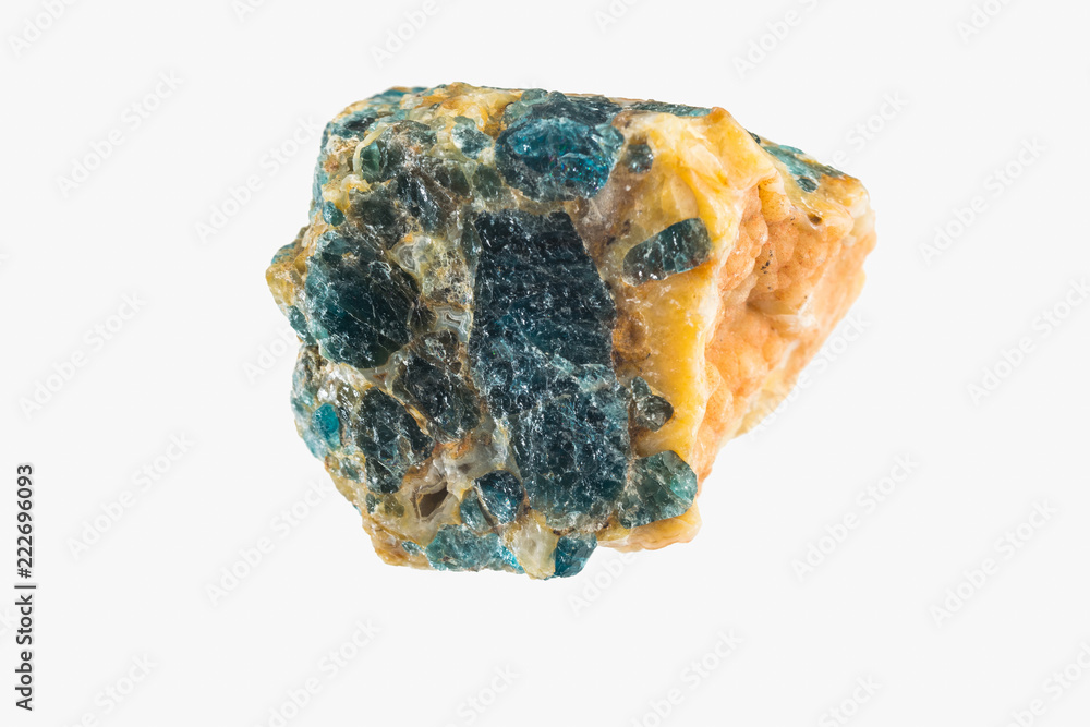 Bright apatite stone crystal isolated. Macro shooting. Bright apatite stone crystal isolated. Macro shooting.