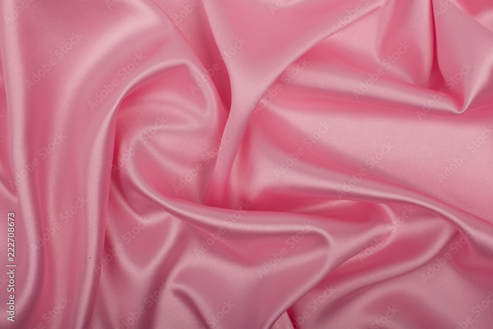 Fototapeta premium Pink satin fabric as background.