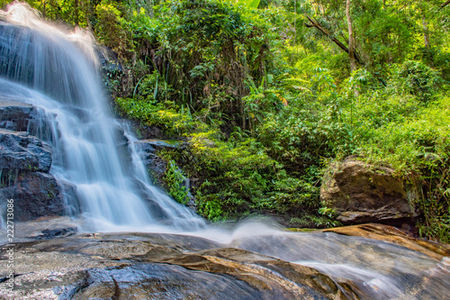 Waterfall spread from the peak in tropical forests.