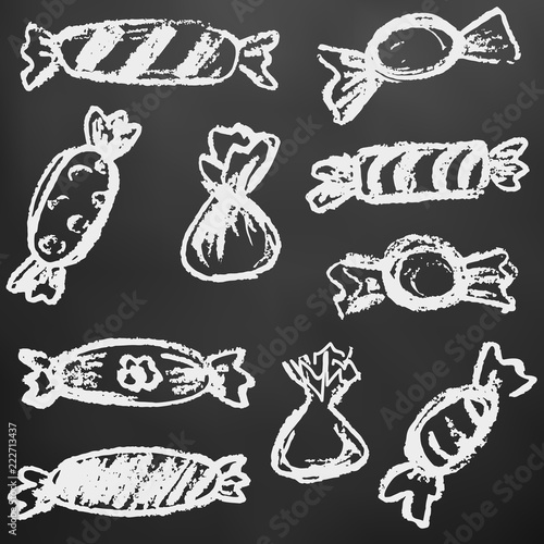 Child drawing with white chalk on a black board. Design elements of packaging, postcards, wraps, covers. Sweet children's creativity. Candy, sweets