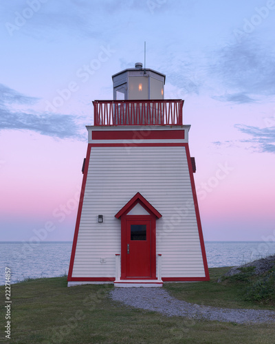 Fox Point Lighthouse at sunset in St. Anthony, Newfoundland