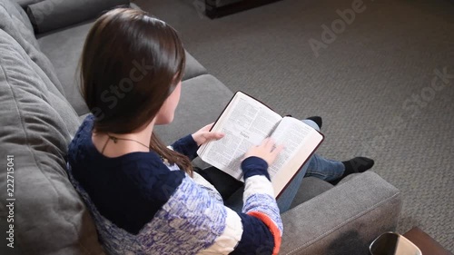 Young woman reading the bible