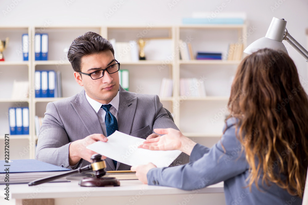 Lawyer discussing legal case with client Lawyer discussing legal case with client