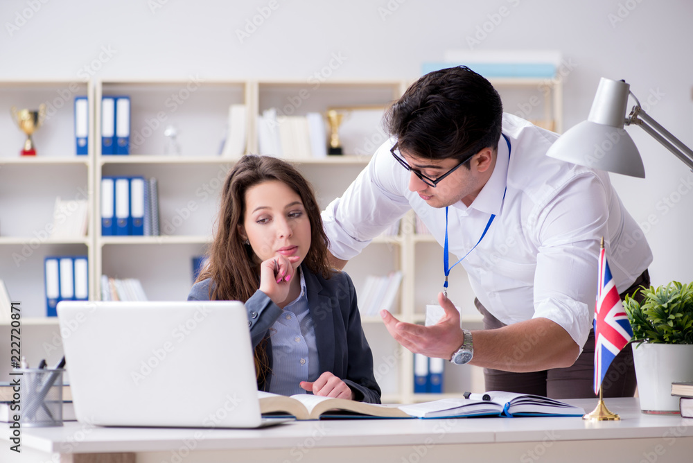 Teacher explaining to student at language training Teacher explaining to student at language training