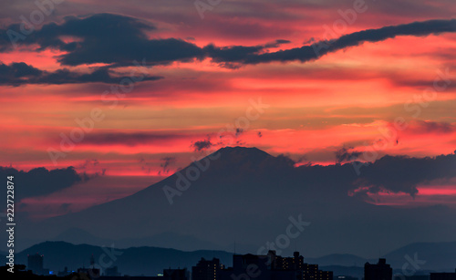 Blood red sunset behind the silhouette of mount Fuji