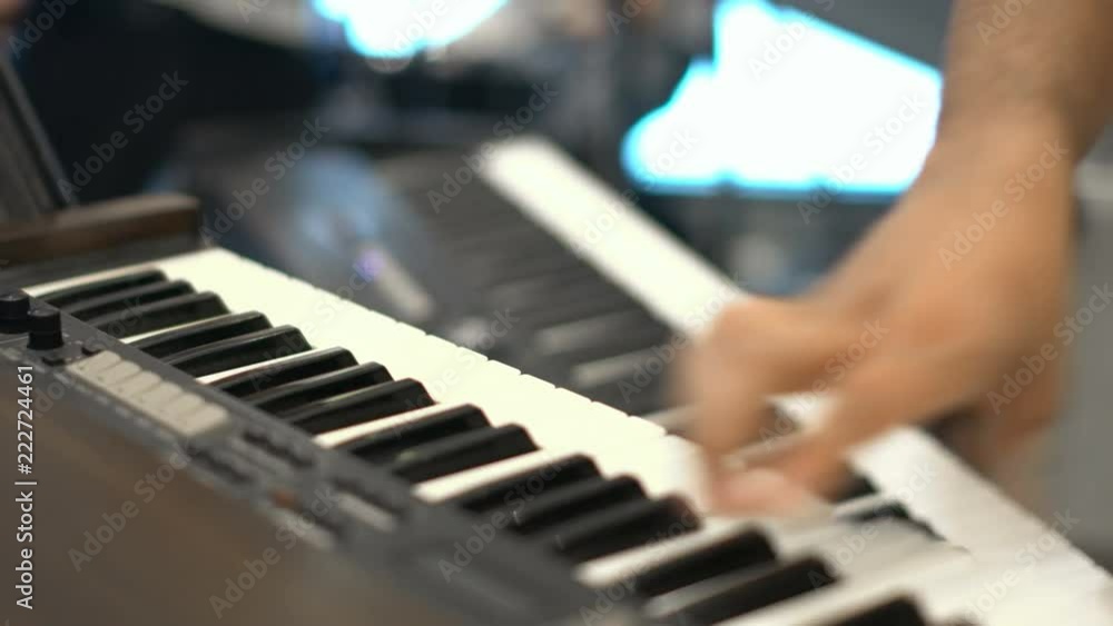 close-up musician lead electric keyboard in live concert musical band close-up musician lead electric keyboard in live concert musical band