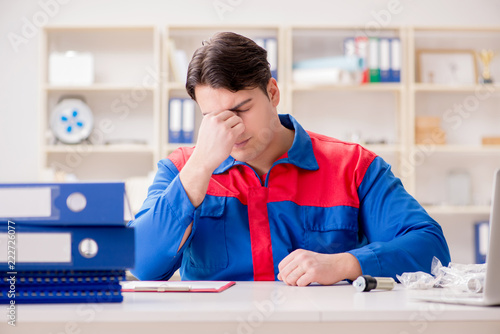 Worker in uniform working on project