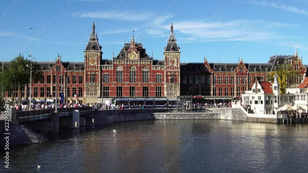 City center of Amsterdam. Trams in front of Amsterdam Central station, Europe. City center of Amsterdam. Trams in front of Amsterdam Central station, Europe.