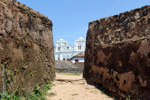 The Meera Mosqe within the Galle Fort, seen from between of two rocks