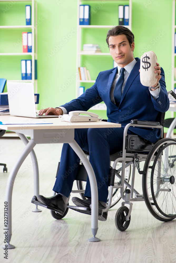 Disabled businessman working in the office Disabled businessman working in the office